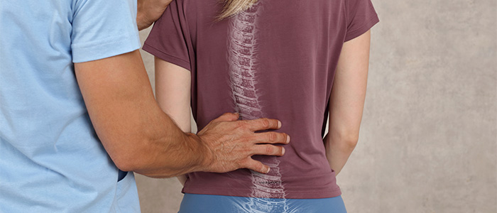 a doctor with his hand on patients back